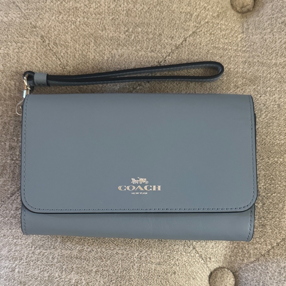 LIKE new Coach vintage wristlet wallet in cornflower blue-has leather flaw.